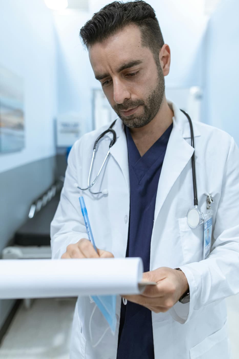 Doctor reviewing patient paperwork during medical review